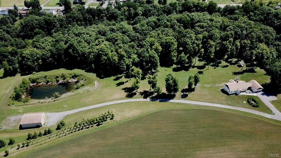 Arial shot,barn+pond on left, house on right,dark 