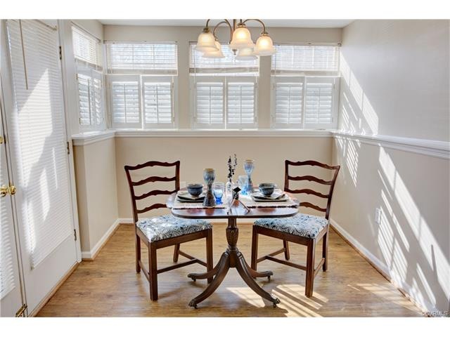 Bright dining space that opens to private patio ar