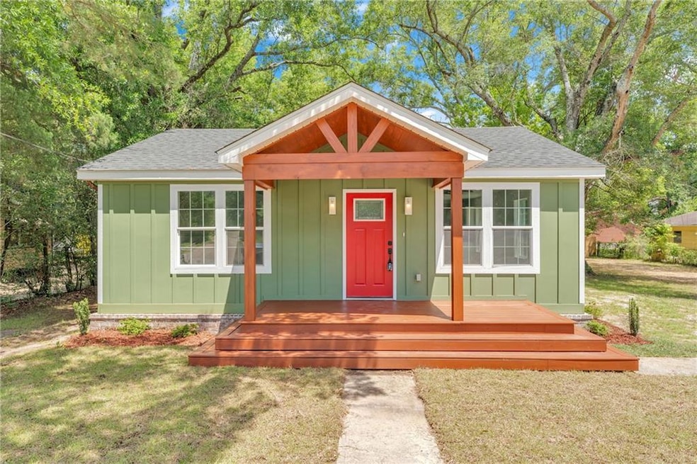 View of front of house featuring board and batten 