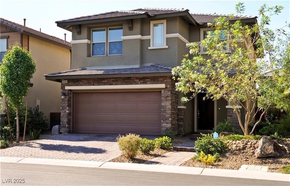 View of front of house featuring stone siding, stu