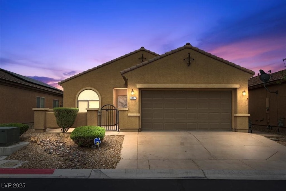 View of front of home featuring a garage, stucco s
