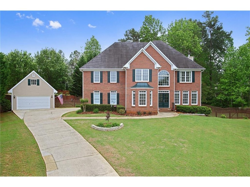 Front of home with Huge yard and additional Garage