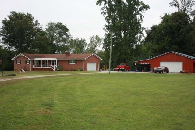 Welcome to 212 Miller Rd. Imagine living on these 9 plus acres with it's captivating mountain view. Beautifully remodeled, spacious brick home with a full basement. Opportunities are endless with the over sized workshop, 2 barns, a pond & more.
