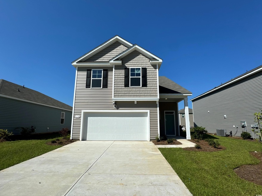 View of front of home with a front yard, central A