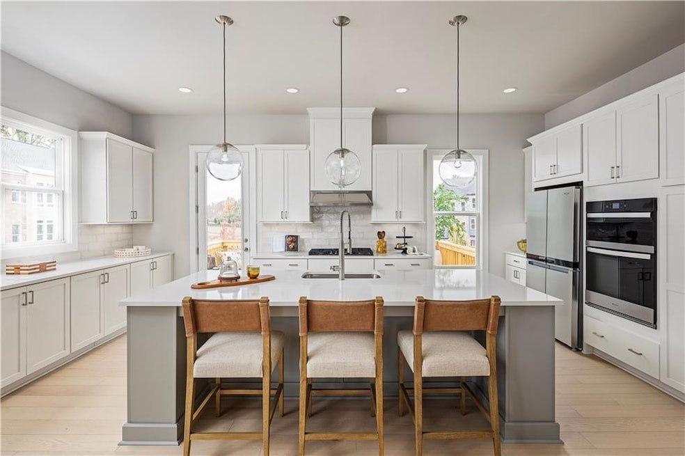 Kitchen featuring appliances with stainless steel 