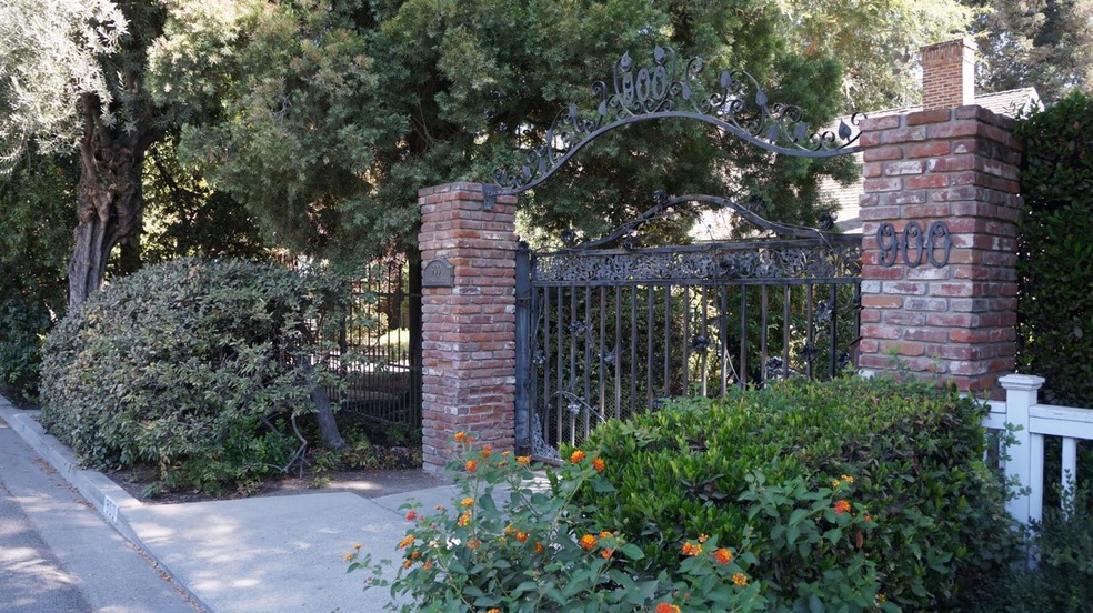 Home entrance with custom rod iron gate.