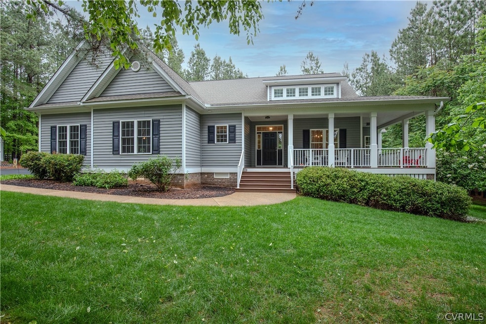 View of front of property featuring a front lawn and a porch