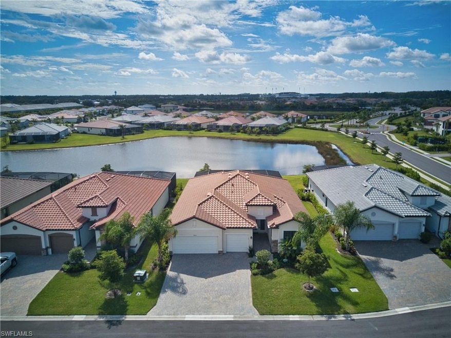 Aerial view of house with lake view
