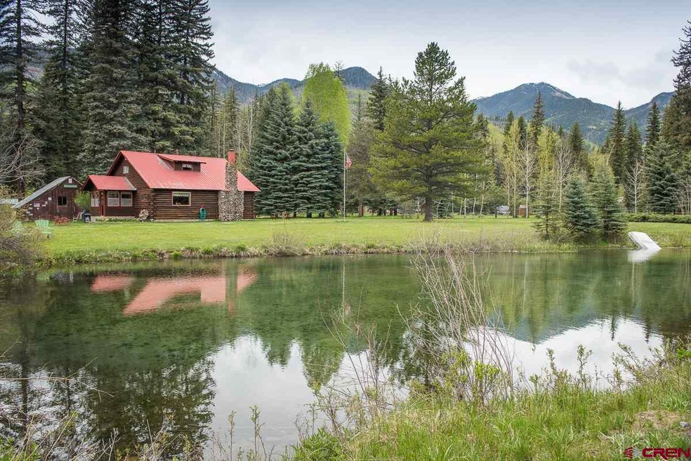 View of Home and Mountains From Across Pond on Pro