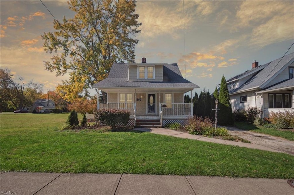 Bungalow-style home with a porch and a lawn