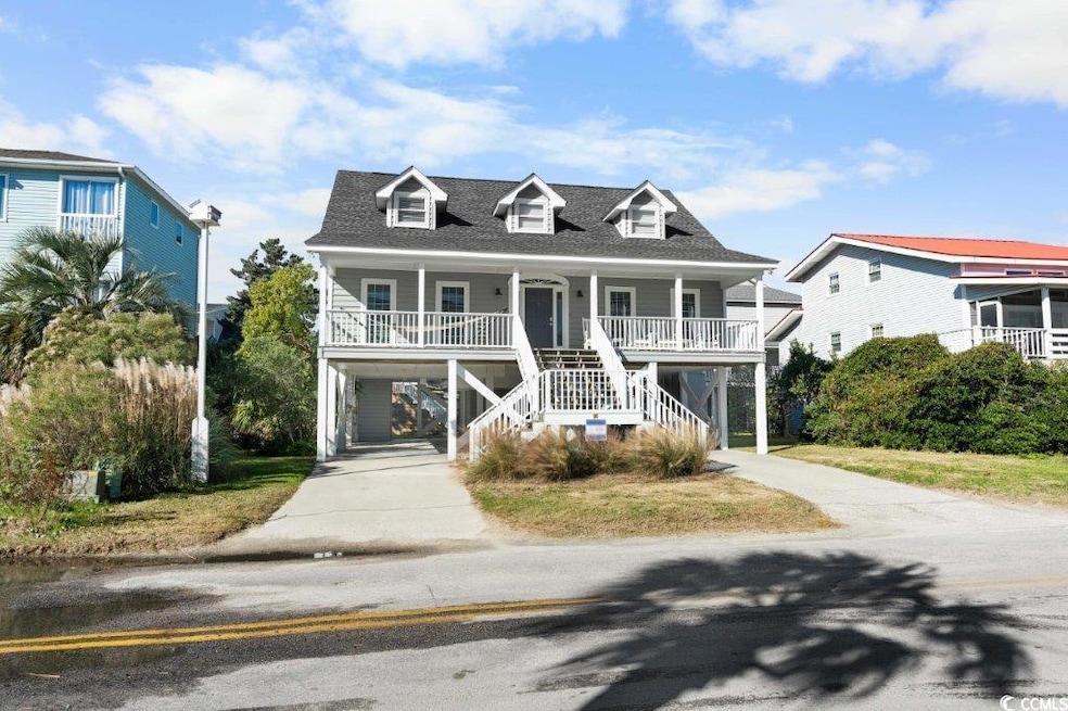 Coastal home featuring a porch