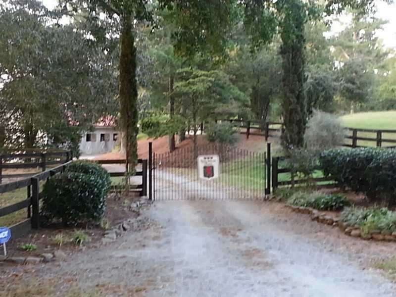 Exterior Front. Entry into Lion Heart Farm