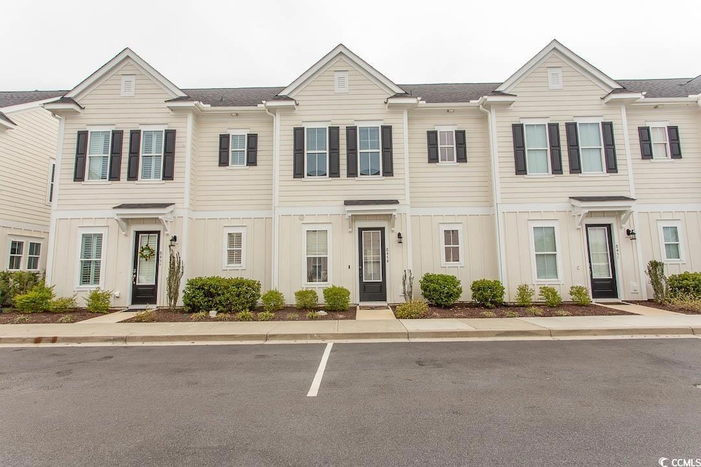 Townhome / multi-family property featuring board a