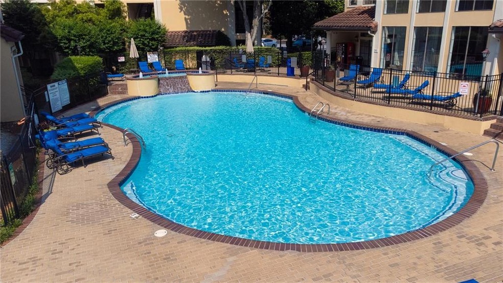 Community pool featuring a patio