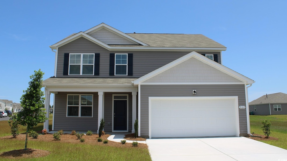 View of front of house with driveway, an attached garage, roof with shingles, and covered porch