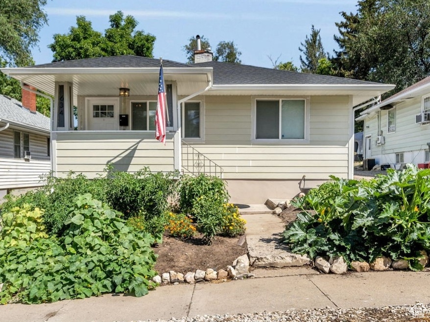 Bungalow featuring a chimney