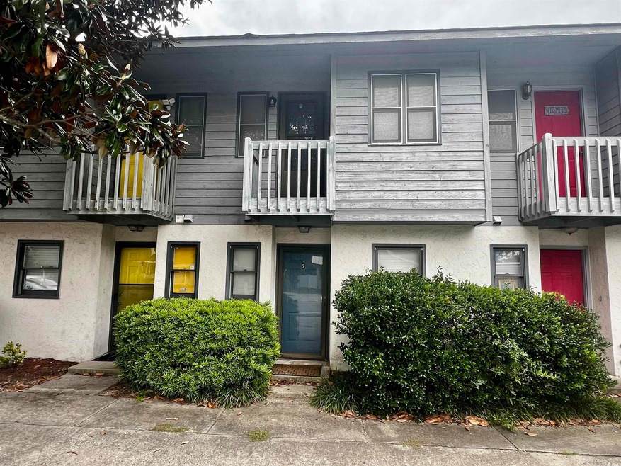 Multi unit property featuring a balcony