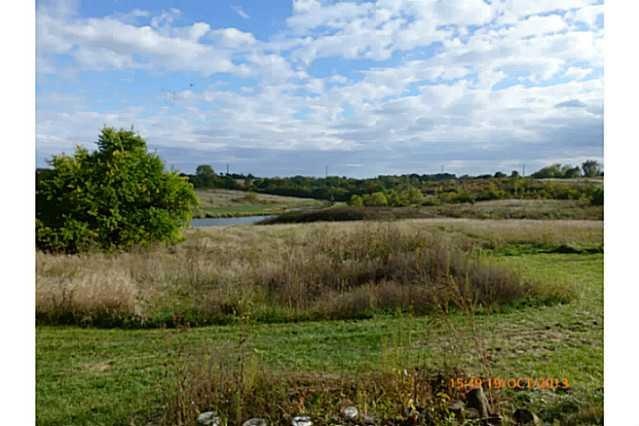 Exterior Front. View of Prairie and 2 stocked pond