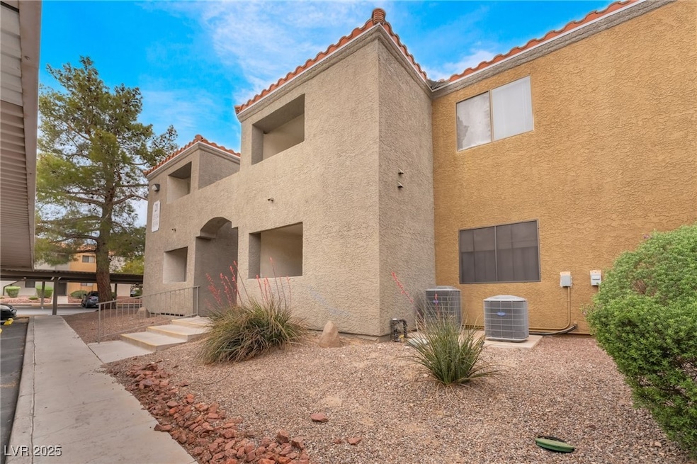 View of property featuring central AC unit