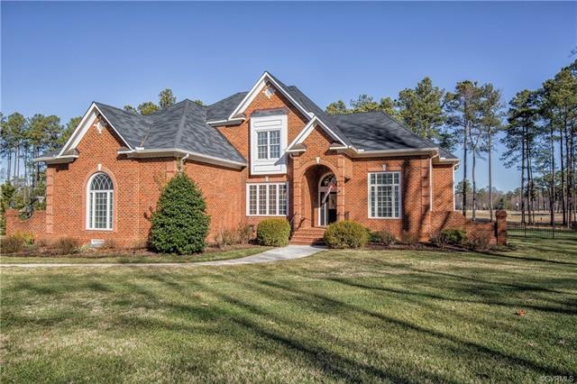 WHAT CURB APPEAL!  Situated on the 9th hole of the