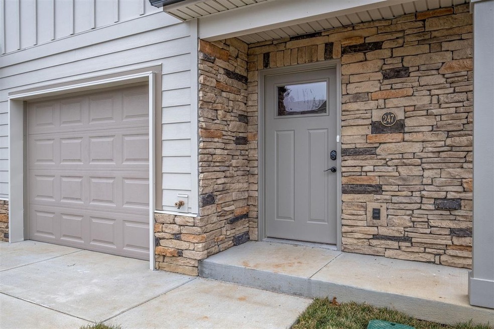 1 car garage - stone accents  **Photo of model hom