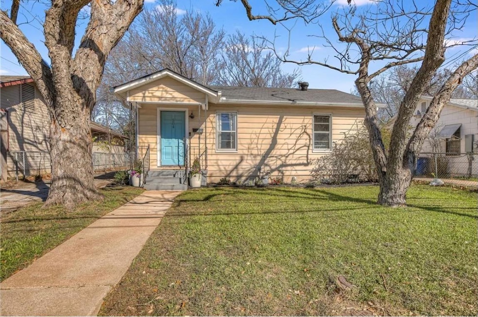 View of front of home featuring roof with shingles