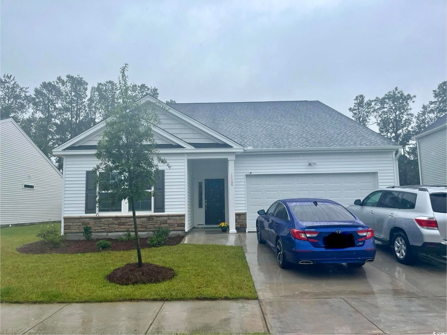 View of front of property featuring a front yard a