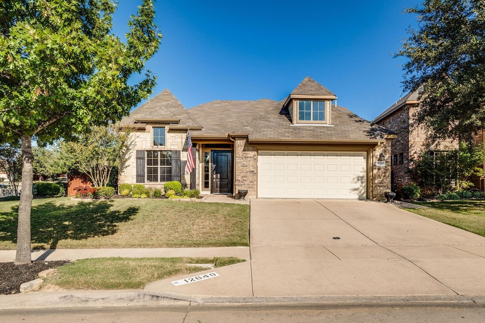 View of front of home featuring a garage and a fro