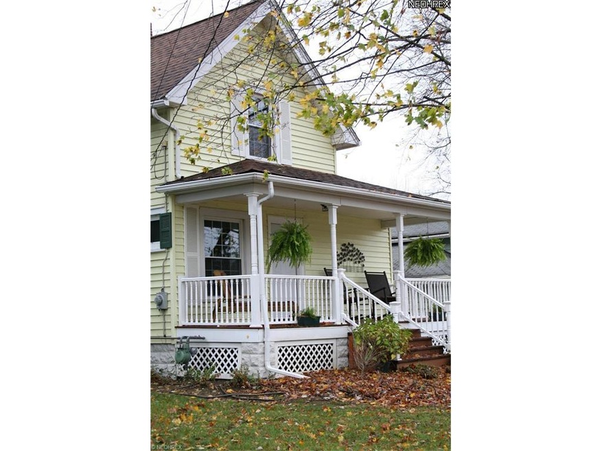 The charming front porch on this house lets you ki
