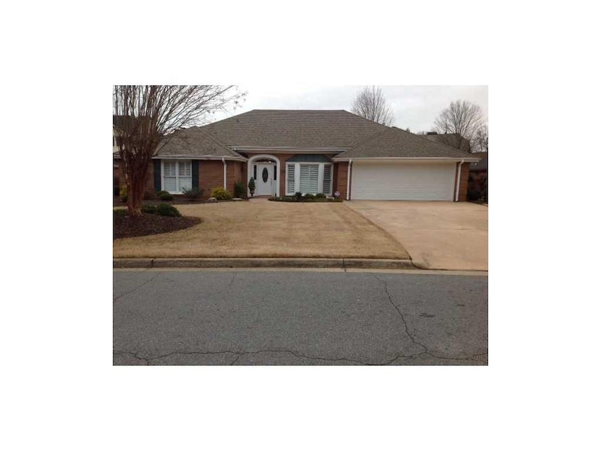 Exterior Front. four sided brick ranch .