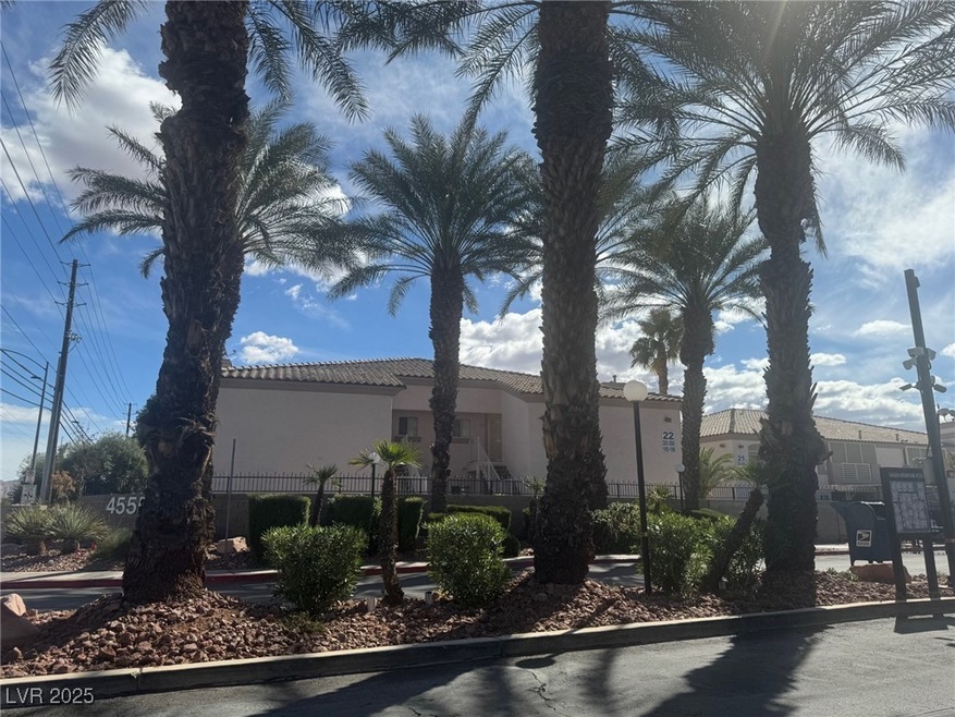 View of property exterior with fence and stucco si