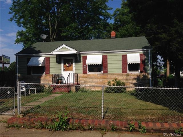 Exterior Front. Stone with Aluminum Siding. Roof w
