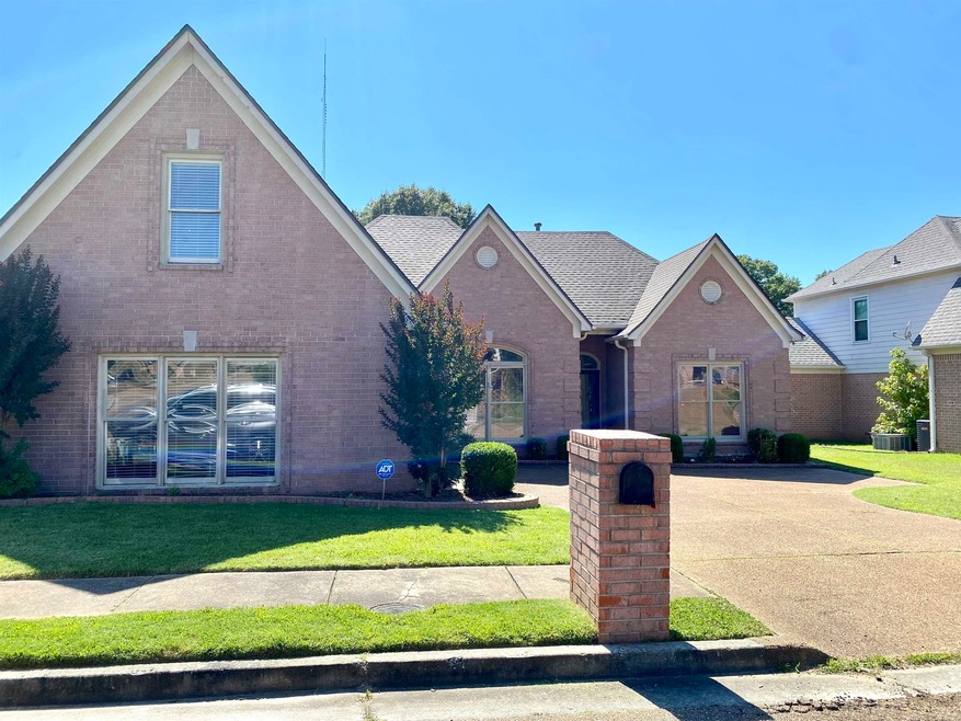View of property with a front lawn