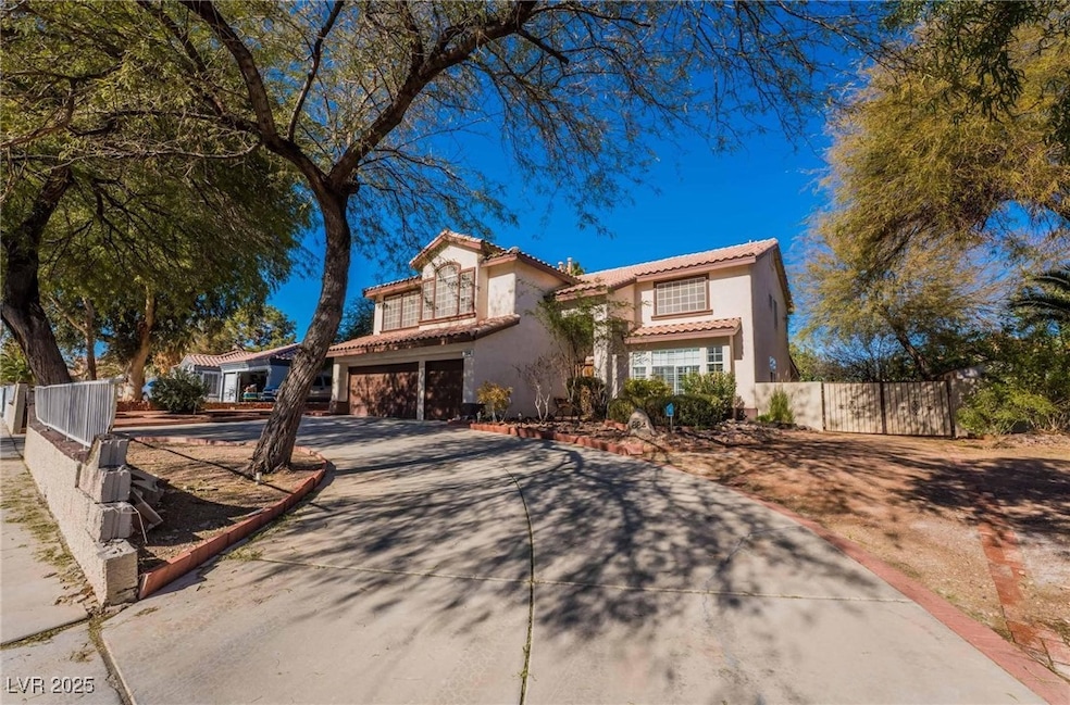 Mediterranean / spanish-style house featuring a balcony, driveway, a tile roof, stucco siding, and an attached garage