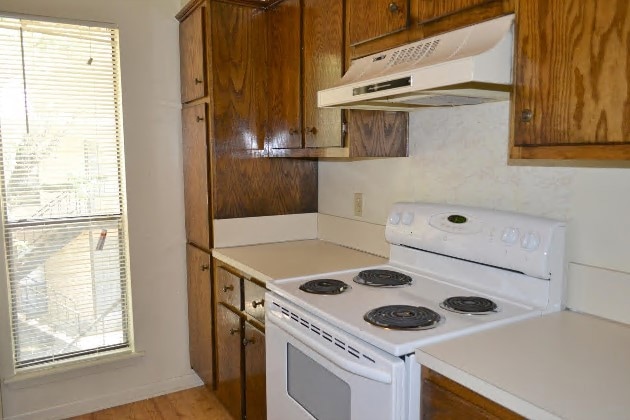 Kitchen featuring light countertops, plenty of nat