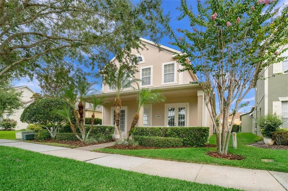 COVERED FRONT PORCH WITH VIEWS OF TRANQUIL POND!