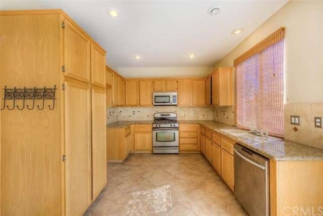 Remodeled kitchen features granite counter tops, c