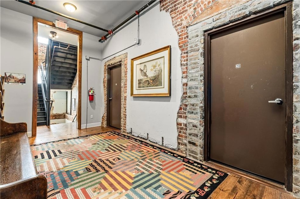 Foyer with stairs and wood finished floors