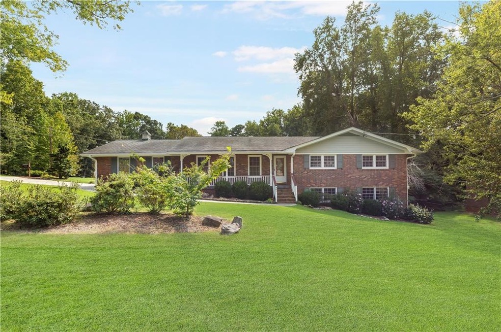House is located on corner lot that is beautifully