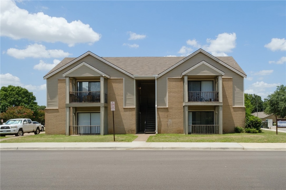 View of front facade featuring brick siding and a
