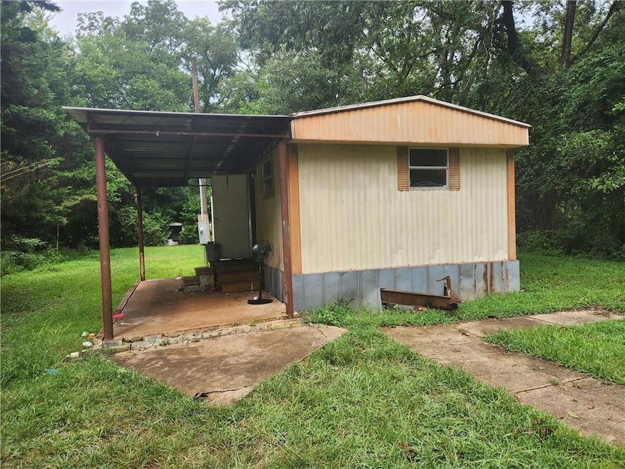 View of outbuilding with entry steps
