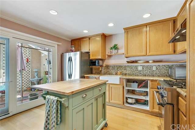 Light bright Kitchen opens to the private patio.