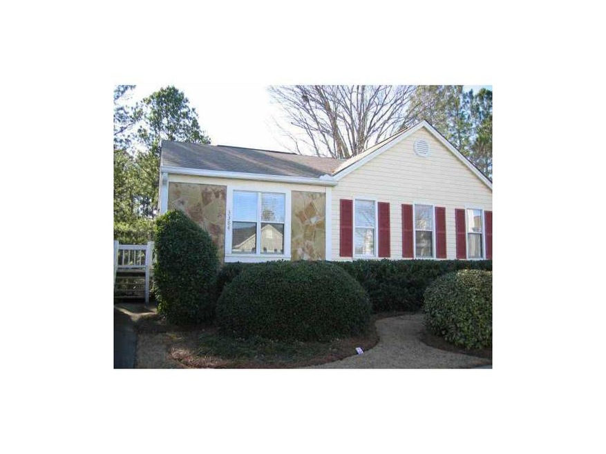 Exterior Front. Vinyl siding with stone trim