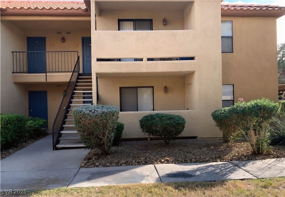 View of property with stairway