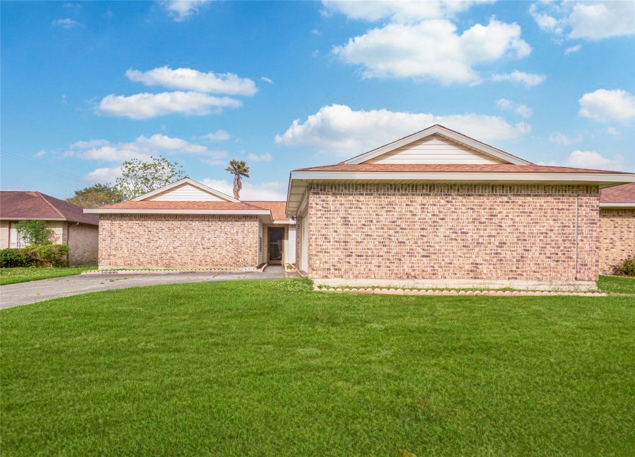 Front - long double wide driveway w/ 2 car attached garage