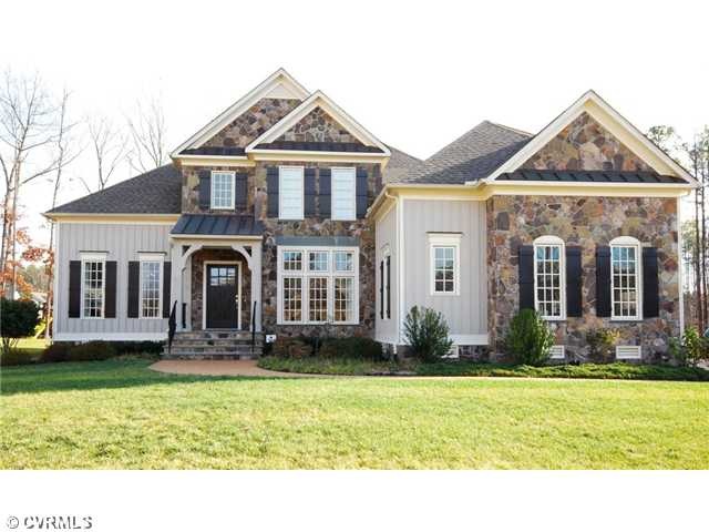Exterior Front - Stone with board and batten exter