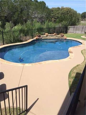 Pool built by Cody Pools. Large sundeck with bubblers, 2 benches in deep end plus water fountain in rock wall. Large patio area for lounging. Greenbelt provides great privacy.  Covered porch is cable TV ready.