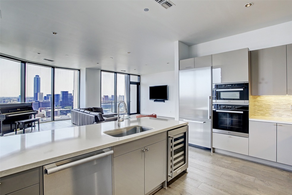 Open-concept kitchen with high end cabinetry and a
