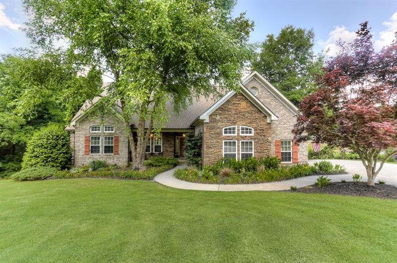 One acre beauty with 4 sided brick and stone accen