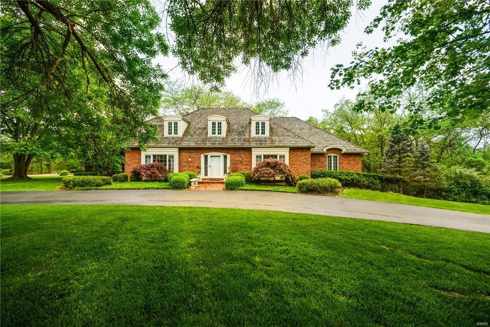 Enjoy this spacious private shake roof home on one acre lot with immediate access to Queeny Park!
